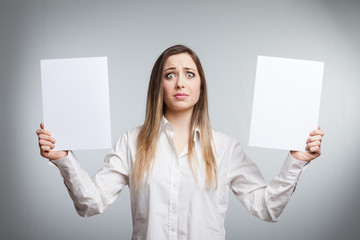 young woman holding blank paper