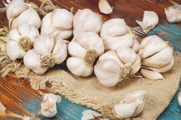 String of garlic on wooden background