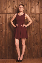 Fototapeta premium beautiful girl in a burgundy dress