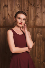 Fototapeta premium beautiful girl in a burgundy dress