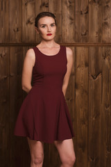 beautiful girl in a burgundy dress