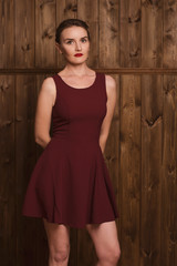 Naklejka premium beautiful girl in a burgundy dress