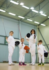 Children fencers and their  trainer