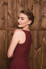 Fototapeta premium beautiful girl in a burgundy dress