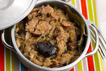 traditional polish sauerkraut (bigos) with mushrooms and plums