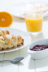 delicious breakfast with croissants and juice