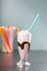 chocolate milkshake on blue background