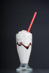 vanilla milkshake on black background
