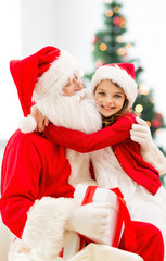 smiling little girl with santa claus
