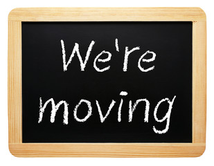 We are moving - Blackboard on white background