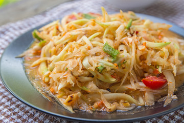 Closeup Thai papaya salad serve with vegetables, popular thai