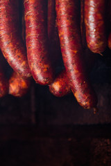 Traditional food. Smoked sausuages in smokehouse.