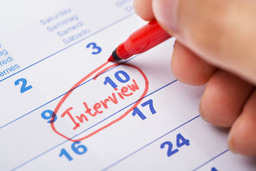 Hand Marking Interview On Calendar