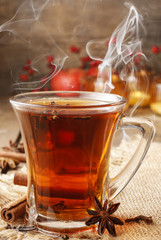 Glass of christmas hot steaming tea