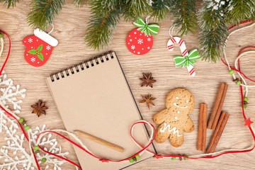 Christmas fir tree, decor, gingerbrean man and blank notepad