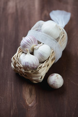 Wicker tray with chinese garlic, vertical shot
