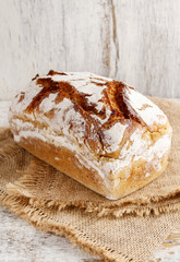 Bread on white wooden background