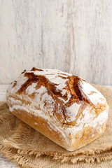 Bread on white wooden background