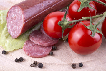 sliced salami with Cherry tomato and seasoned with black pepper