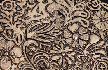 Floral pattern on brass plate