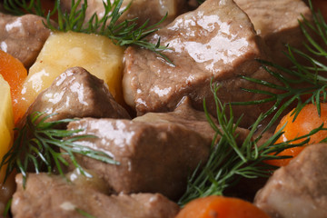 stew with vegetables and dill close-up. background horizontal