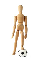 mannequin old wooden dummy acting about soccer isolated on white