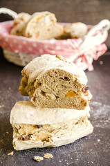 Composition with bread and rolls in wicker basket isolated on