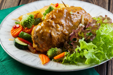 Pork rolls with prepared potatoes and vegetables