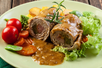 Pork rolls with prepared potatoes and vegetables