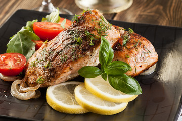 Fried salmon steak with vegetables