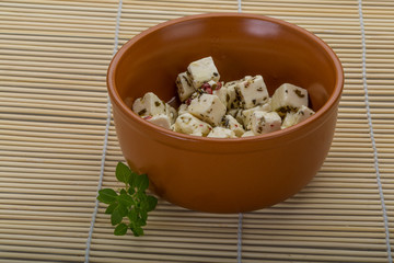 Cheese with spices and oil