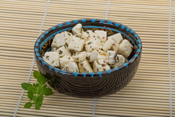 Cheese with spices and oil
