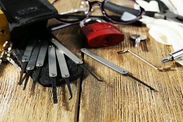 Tools of picking locks on wooden table