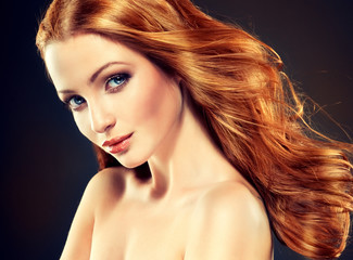 Beautiful model with long curly red hair