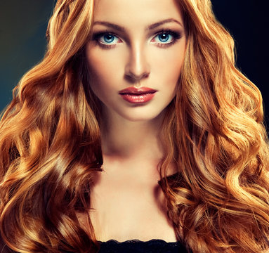 Beautiful model with long curly red hair