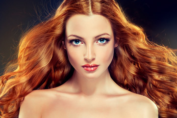 Beautiful model with long curly red hair