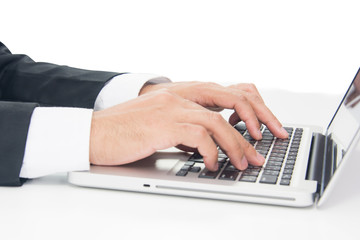 Businessman Sitting Working on Laptop