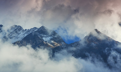 Snow covered mountains and rocky peaks in Himalaya