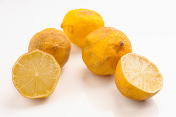 rotten lemons on white base