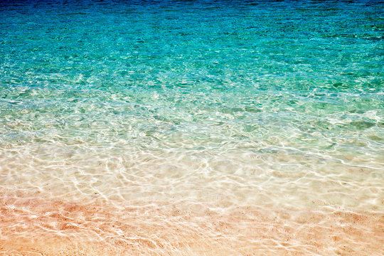 Pink sand under water with ripples on Komodo island, Indonesia