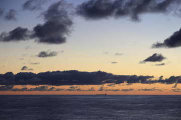 Lone Oil Tanker ship on the horizon at sea