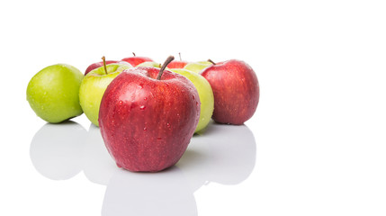 Red and green apple over white background