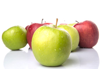 Red and green apple over white background
