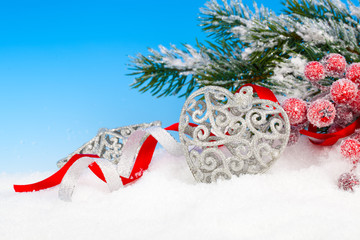 Christmas decoration over snow, blue background
