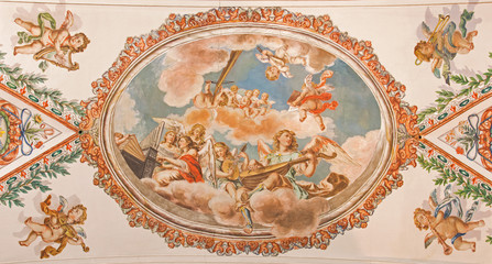 Seville - angels with music instruments baroque fresco