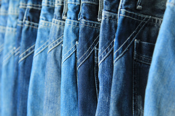 Row of hanged blue jeans