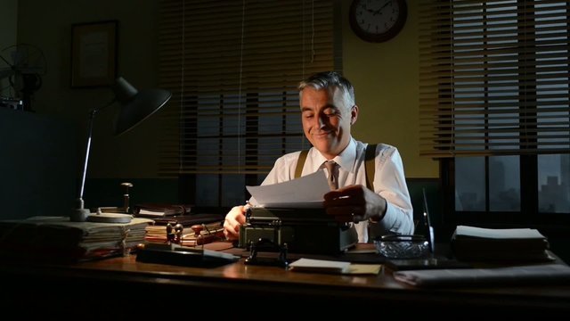 Vintage smiling businessman turning off desk lamp and leaving of