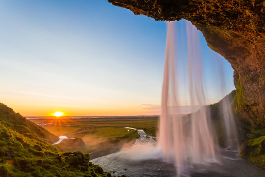 Seljalandsfoss, waterfall in Iceland, sunset and sunstar © ronnybas