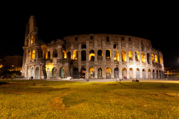 Fototapeta na wymiar Colosseum in Rome against the stellar sky