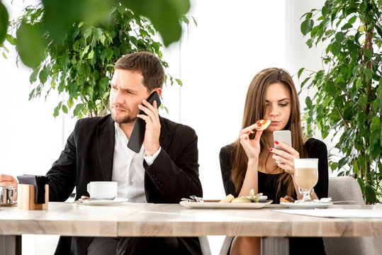 Young Couple At The Restaurant